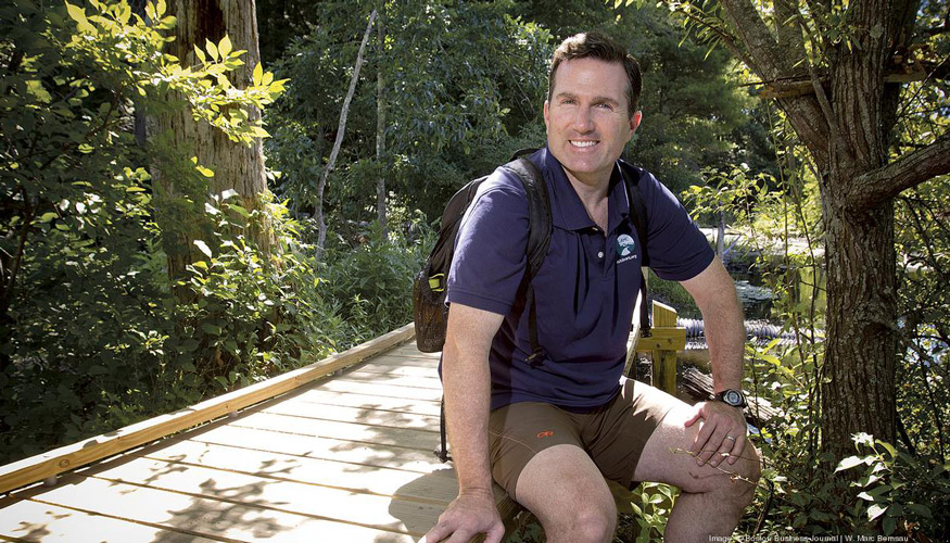 John Judge, president and CEO of Appalachian Mountain Club, on a trail in the Georgetown Rowley State Forest, part of the Bay Circuit Trail