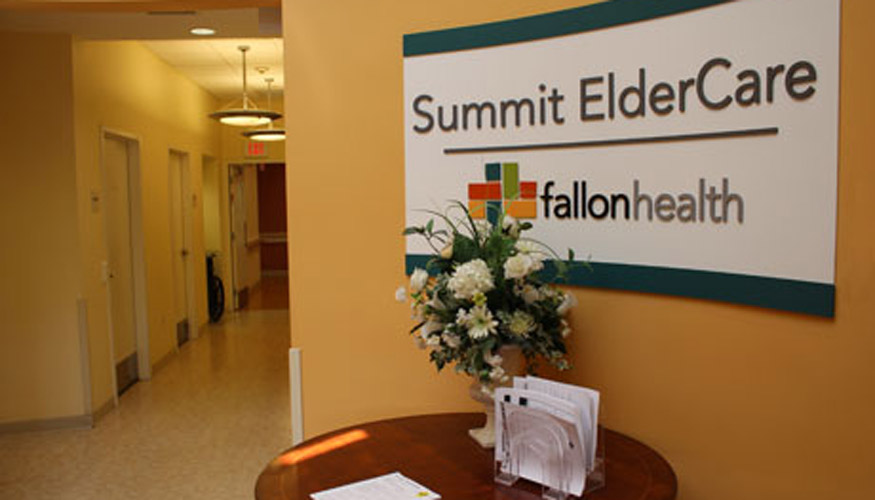 Summit ElderCare Entrance with sign and flowers on table