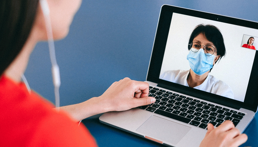 A woman on a telehealth call with her doctor