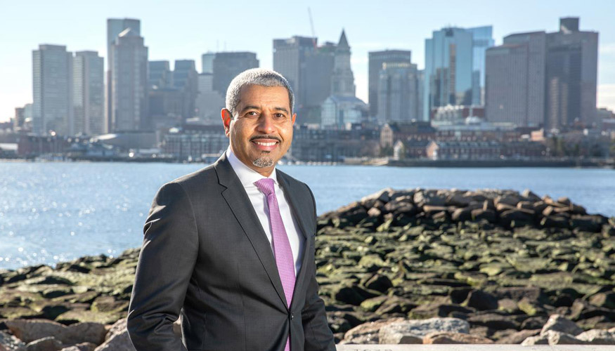 Manny Lopes in front of Boston skyline