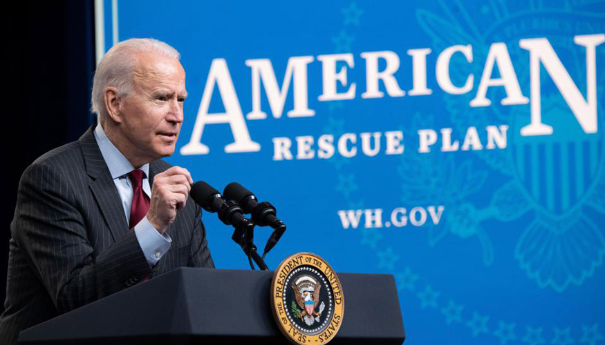 President Biden speaking at podium