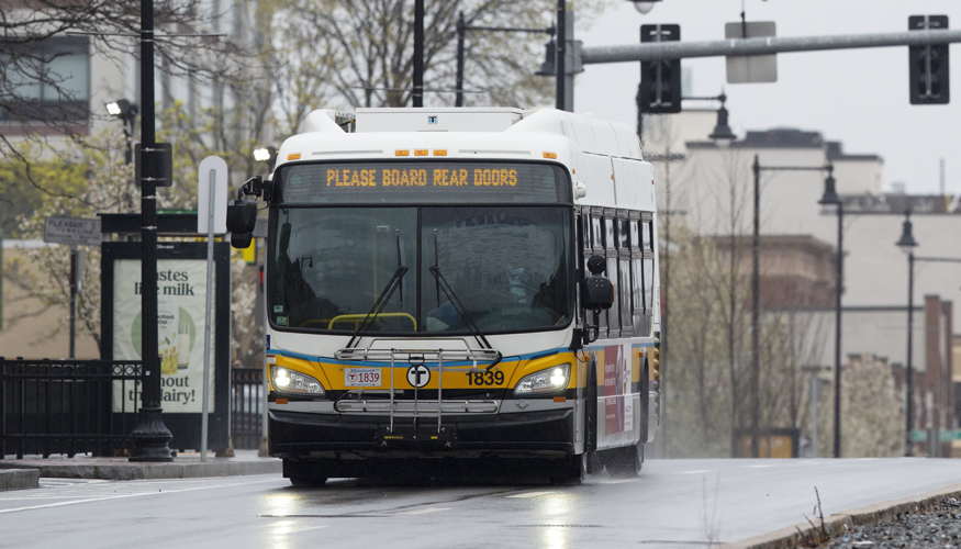 An MBTA bus runs along Commonwealth, Ave., Friday, April 24, 2020, in Boston