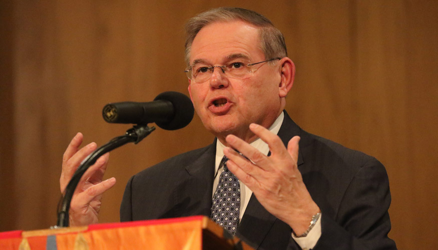 Senator Bob Menendez speaking at podium with mic